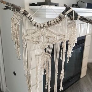 Macrame decorative piece made on driftwood